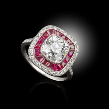 A rare art deco Diamond ring, surrounded by rubies and diamonds